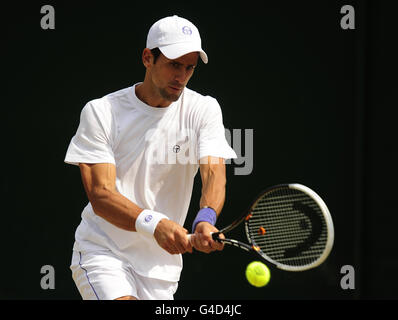 Serbia's Novak Djokovic during a practice session on court 19 during day twelve of the 2011 Wimbledon Championships at the All England Lawn Tennis and Croquet Club, Wimbledon. Stock Photo