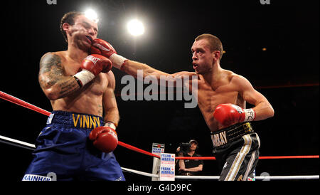 John Murray (right) in action against Kevin Mitchell during the WBO World Super-Featherweight Championship bout at the Liverpool Echo Arena, Liverpool. Stock Photo