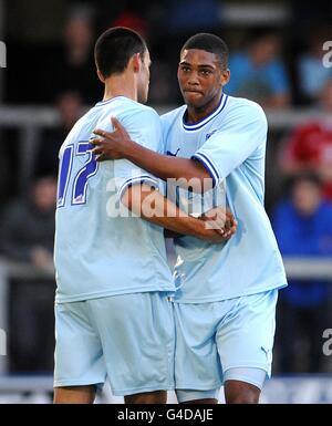 Soccer - Pre Season Friendly - Hinckley United v Coventry City - Greene King Stadium. Coventry City's Conor Thomas (left) celebrates with team mate Shaun Jeffers after scoring his side's third goal of the game Stock Photo