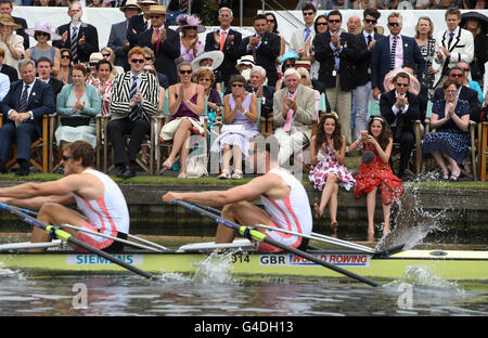 Spectator's in the Stewards Enclosure watch Leander Club and Reading University win Queens Mother Challenge Cup during day five of the Henley Royal Regatta, Henley-on-Thames. Stock Photo