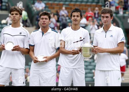 Great Britain's George Morgan (right) and Croatia's Mate Pavic pose with the trophy and Great Britain's Oliver Golding and Czech Republic's Jiri Vesely (left) with their runners up trophies after the Boys' Doubles on day thirteen of the 2011 Wimbledon Championships at the All England Lawn Tennis Club, Wimbledon. Stock Photo