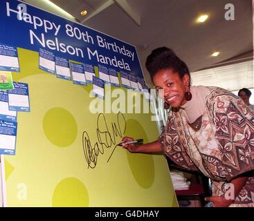 South African High Commissioner, Cheryl Carolus, is the first to sign a giant 80th Birthday card for President Mandela, at the Royal Festival Hall in London today (Sat). President Nelson Mandela married his long-time sweetheart Graca Machel today. Photo by Andrew Stuart. Stock Photo