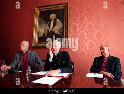 (L-R) The Most Reverend and Rt. Hon. George L. Carey, The Archbishop of Canterbury, Reverend Michael Alan Houghton and the Right Reverend Frank Sargent, The Bishop at Lambeth in front of a 1761 painting of Thomas Newton, the Former Bishop of Bristol at Lambeth Palace this morning where it was announced that Reverend Houghton is to be the new Bishop of Ebbsfleet. Photo by Matthew Fearn/PA Stock Photo