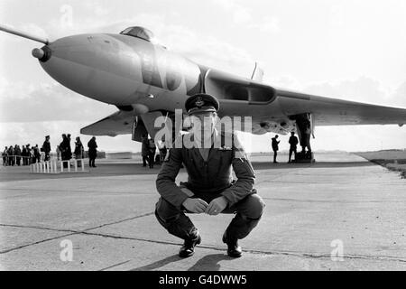 Squadron leader Peter Stannard on the runway at the Imperial War Museum in Duxford after flying the Avro Vulcan behind him to the museum for retirement Stock Photo