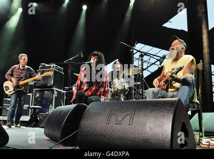 Seasick Steve (right) with guests (left to right) John Paul Jones, bassist of Led Zeppelin, singer Alison Mosshart of The Kills and Jack White of White Stripes on drums, perform on stage at the Roundhouse, Chalk Farm, London, as part of the iTunes Festival 2011. Stock Photo