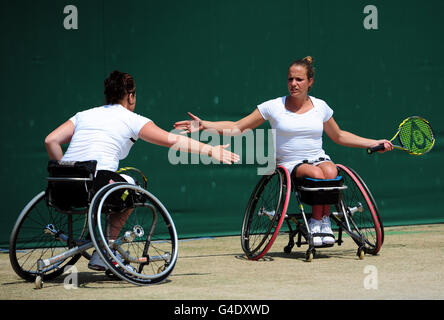 Netherlands' Jiske Griffioen (right) and Aniek Van Koot (left) celebrate during their match against Netherlands' Esther Vergeer and Sharon Walraven on day thirteen of the 2011 Wimbledon Championships at the All England Lawn Tennis and Croquet Club, Wimbledon. Stock Photo