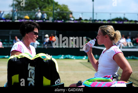 Netherlands' Esther Vergeer (right) and Sharon Walraven (left) celebrate during their match against Netherlands' Jiske Griffioen and Aniek Van Koot on day thirteen of the 2011 Wimbledon Championships at the All England Lawn Tennis and Croquet Club, Wimbledon. Stock Photo