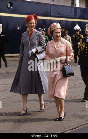 Queen Elizabeth II walks along the quay at Aarhus with Queen Margrethe of Denmark after arriving on the Royal yacht Britannia Stock Photo