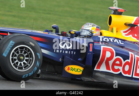 Red Bull's Sebastian Vettel of Germany goes around club corner during the second practice session during Practice for the Formula One Santander British Grand Prix at Silverstone Circuit, Northampton. Stock Photo