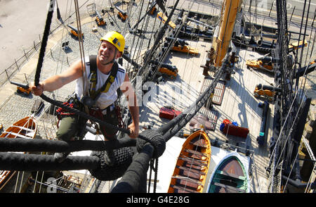 Ian Bell climbs the main mast of Admiral Lord Nelson's flagship, HMS Victory, at the Royal Navy Dockyard in Portsmouth, during her most extensive restoration project since she was repaired following the Battle of Trafalgar in 1805. Stock Photo