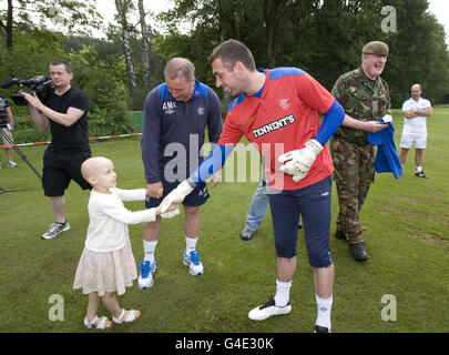 SPECIAL PICTURE - RELEASED EXCLUSIVELY THROUGH THE PRESS ASSOCIATION FOR USE BY NATIONAL AND REGIONAL NEWSPAPERS - UK & IRELAND ONLY. NO SALES.Rangers' Allan McGregor (right) greets Alissa Ford who suffered from a brain tumor, during their pre-season training camp at the team hotel in Herzlake, Germany. Picture date: Tuesday July 12, 2011. Photo credit should read: Kirk O'Rourke/Rangers FC/PA. FOR MORE RANGERS PICTURES OR LICENSING OF THESE IMAGES FOR OTHER USE - PLEASE CONTACT EMPICS - 0115 844 7447OR info@empics.com Stock Photo