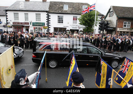 The coffin of Lance Corporal Paul Watkins, 24, who served with the 9th/12th Royal Lancers (Prince of Wales's), passes through Wootton Bassett in Wiltshire following his repatriation ceremony at RAF Lyneham. Stock Photo