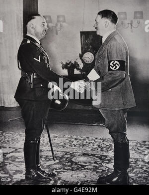 Adolf Hitler presents Heinrich Himmler with his inauguration certificate as Reich SS leader and Chief of the German Police in the Reich interior Ministry Berlin June 17 1936 (  Topographie of Terror historical museum on site of former Gestapo headquarters ) Berlin Germany Stock Photo