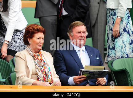 Tennis - 2011 Wimbledon Championships - Day One - The All England Lawn Tennis and Croquet Club. Sir Terry Wogan and his wife Lady Helen watch the action from the Royal Box Stock Photo
