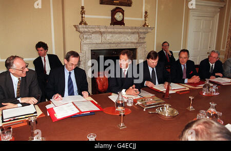 Prime Minister Tony Blair, centre, is flanked left to right by Scottish Secretary Donald Dewar, Secretary of the Cabinet Sir Richard Wilson, Deputy Prime Minister John Prescott, Minister for the Cabinet Office and Chancellor of the Duchy of Lancaster Jack Cunningham, and Secretary of State for National Heritage Chris Smith during the first cabinet meeting since the reshuffle. Stock Photo