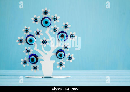 Decorative evel eye beads, Turkish traditional amulet on blue background Stock Photo