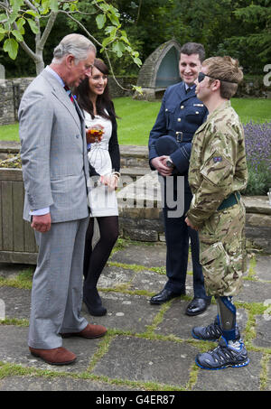 The Prince of Wales talks with Cpl Ricky Fergusson, right, who was ...