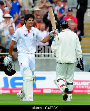 England's Alastair Cook celebrates after reaching a double century next to India's captain MS Dhoni during the npower Test match at Edgbaston, Birmingham. Stock Photo