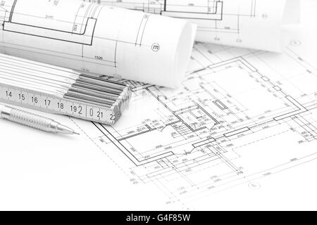 architect workspace with blueprint rolls and floor plan Stock Photo - Alamy