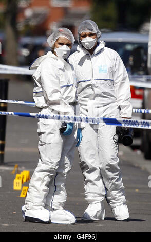 Scenes of crime officers pictured on Shrewsbury Street, Manchester after a shopkeeper was arrested on suspicion of attempted murder after a man trying to rob his store was stabbed to death. Stock Photo