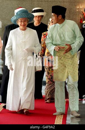 The Queen, dressed in a Muslim 'gamis' made especially for her and brought from England, tours the Jame'Asr Hassanil Bolkiah Mosque in Bandar Seri Begawan during the second day of her three day State visit to Brunei. Stock Photo