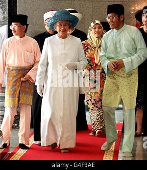 The Queen, wearing a Muslim 'gamis' made especially for her in England, views the Jame'Asr Hassanil Bolkiah Mosque in Bandar Seri Begawan during the second day (Friday) of her three day State visit to Brunei. Photograph by Fiona Hanson/PA Stock Photo