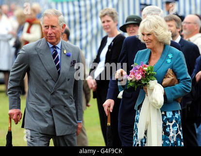 The Prince of Wales and Duchess of Cornwall during a visit to the Sandringham Flower Show in Sandringham, Norfolk. Stock Photo