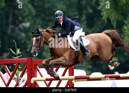 Great Britain's Guy Williams riding Titus in the Nations Cup during the Longines Royal Hickstead International Horse Show at The All England Jumping Course, Hickstead. Stock Photo