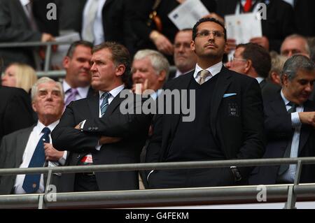 Manchester City chairman Khaldoon Al Mubarak and chief executive Garry Cook (left) appear dejected in the stands Stock Photo