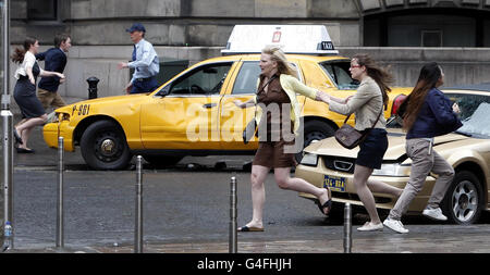 Characters run on set during the filming of World War Z in Glasgow, Scotland. Stock Photo