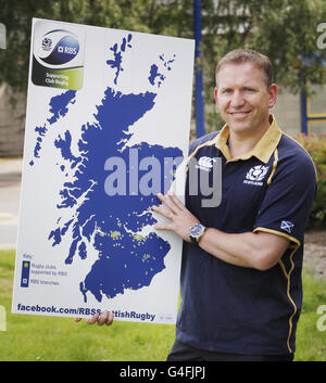 Former rugby star Andy Nichol (centre) with Strathspey rugby players ...