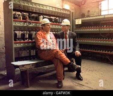 Arts Minister Alan Howarth (right) talks to miner Richard Fisher, in the Lamp Room of the National Coal Mining Museum at Caphouse Colliery near Wakefield, West Yorkshire, before taking up his job at museum today (Wednesday). Mr Howarth pledged a 770,000 grant from his department for next year to save the mine from closure. Photo by John Giles/PA*EDI*. See PA story INDUSTRY Mine Stock Photo