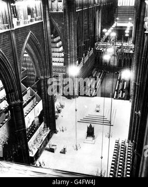 This picture, taken from above the Altar in Westminster Abbey, London, shows the setting for the Coronation of Queen Elizabeth II. Seen in the centre (nearer the camera) and facing the Altar is the Coronation Chair, made in 1300AD at the order of King Edward I. It contains the Stone of Scone. Left foreground is the Chair of Estate, to which the Queen goes for the first part of the ceremony. Before the Chair is a faldstool at which she kneels in private prayer. On a dias beyond the Coronation Chair is the Throne, to which the Queen goes after being crowned. She is lifted into the Throne by the Stock Photo