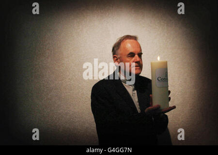 Fr.Aidan Troy with the console candle in the grounds of Kilmainham Hospital during the conference held by Console on suicide. Stock Photo