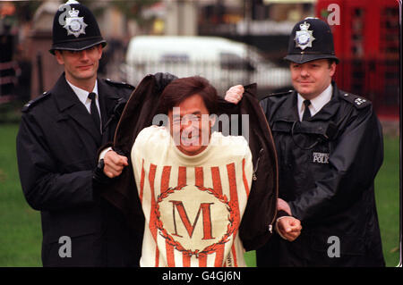 Actor Jackie Chan with Metropolitan police officers during a photocall in London's Leicester Square to promote his latest movie Rush Hour. * 10/11/99 Hollywood action hero Jackie Chan who has admitted that he had an affair with a now-pregnant former beauty queen and said that he will take responsibility if the child is his. Chan, who got his start in Hong Kong, appeared distraught as he said he had apologised to his wife of 18 years, former actress Lin Feng-chiao, and other relatives. Chan said Lin forgave him and called himself lucky to have always had so much support from many people. Stock Photo