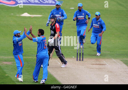 England's Alastair Cook walks off after being bowled by India's Praveen Kumar (second left) during the NatWest One Day International at the Emirates Durham International Cricket Ground in Chester Le Street, Durham. Stock Photo