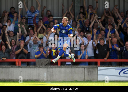 Wimbledon's Gareth Gwillim celebrates scoring their second goal during the npower Football League Two match at the Cherry Red Records Fans' Stadium Kingsmeadow in London. Stock Photo