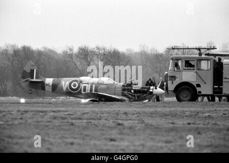 A Spitfire two-seater sits damaged on the runway at Eastleigh Airport after it's undercarriage collapsed. The plane was due to take part in the 50th anniversary celebrations of the Spitfire Stock Photo