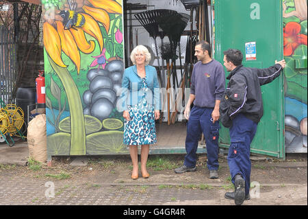 The Duchess of Cornwall talks to gardeners at Walworth Garden Farm, in central London as part of a tour of urban gardens. Stock Photo