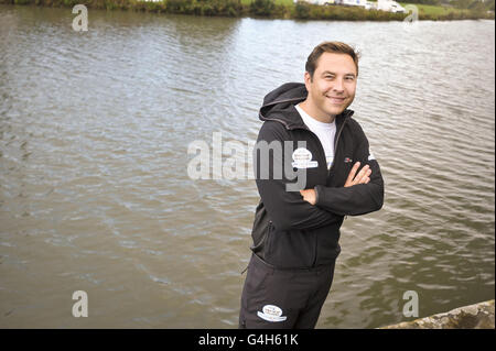 David Walliams stands on the bank of the River Thames in Lechlade, Gloucestershire, before setting off on his attempt to swim the entire length of the River to raise money for Sport Relief. Stock Photo