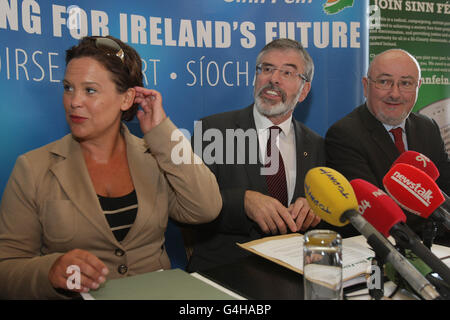 Sinn Fein's (left - right) Mary Lou McDonald TD, Leader Gerry Adams and Caoimhghin O Caolain speak to the media at the Shelbourne Hotel in Dublin as Sinn Fein's team in the Dail and Seanad meet in advance of the resumption of the Dail term. Stock Photo