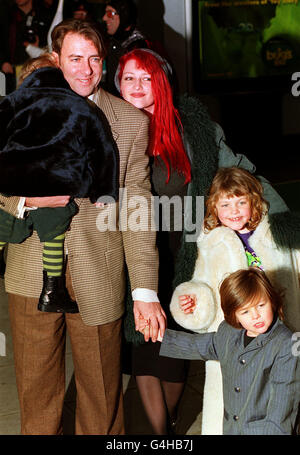 Jonathan Ross, his wife Jane and their children (back to camera, top left) Honey Kinny, Harvey Kirby and Betty Kitten (behind, Harvey) attend the premiere of the Walt Disney film 'It's a Bug's Life', at the Odeon Kensington in London. Stock Photo