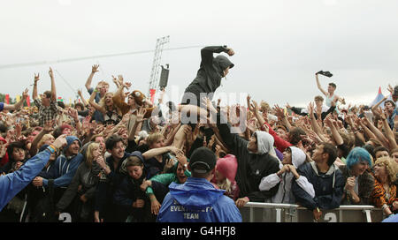 Roughton Reynolds of Enter Shikari crowd surfs in front of the Main Stage at the Reading Festival, at Richfield Avenue in Reading. PRESS ASSOCIATION Photo. Picture date: Sunday August 28, 2011. Photo credit should read: Yui Mok/PA Wire Stock Photo