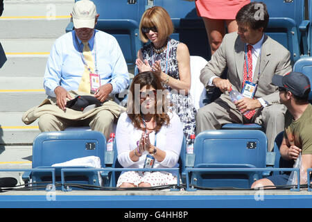 Roger Federer's wife Mirka and Anna Wintour watch Federer play against Israel's Dudi Sela during day four of the US Open at Flushing Meadows, New York, USA. Stock Photo