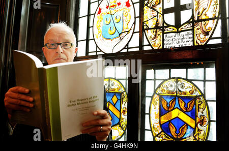 Public interest lawyer, Phil Shiner, studies a copy of the Baha Mousa inquiry report prior a press conference at the Law Society offices in central London, after the findings were made public. Stock Photo