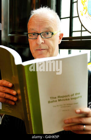 Public interest lawyer, Phil Shiner, studies a copy of the Baha Mousa inquiry report prior a press conference at the Law Society offices in central London, after the findings were made public. Stock Photo