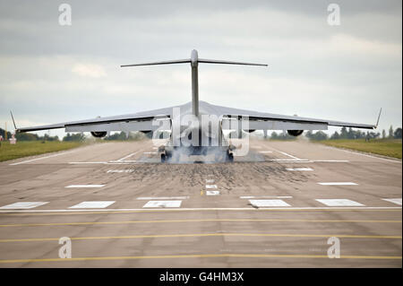 An RAF C-17 plane lands at RAF Brize Norton for the first repatriation at the base in over 4 years. Stock Photo