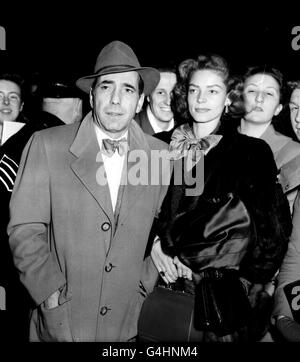 Hollywood stars, husband and wife, Humphrey Bogart and Lauren Bacall on arrival at Victoria Station in London. Bogart was to make his British screen debut in 'The African Queen', to be filmed in Britain and Africa. Stock Photo