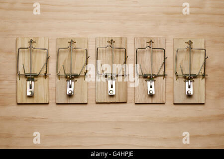 Five mouse traps in a row Stock Photo