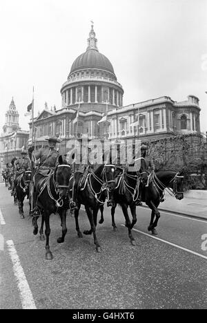 Members of a 36 man troop of the Royal Canadian Mounted Police, in London on a seven week tour to mark the Silver Jubilee, ride past St Paul's Cathedral as they accompany the Canadian High Commissioner, Paul Martin, from Canada House to Mansion House. Stock Photo